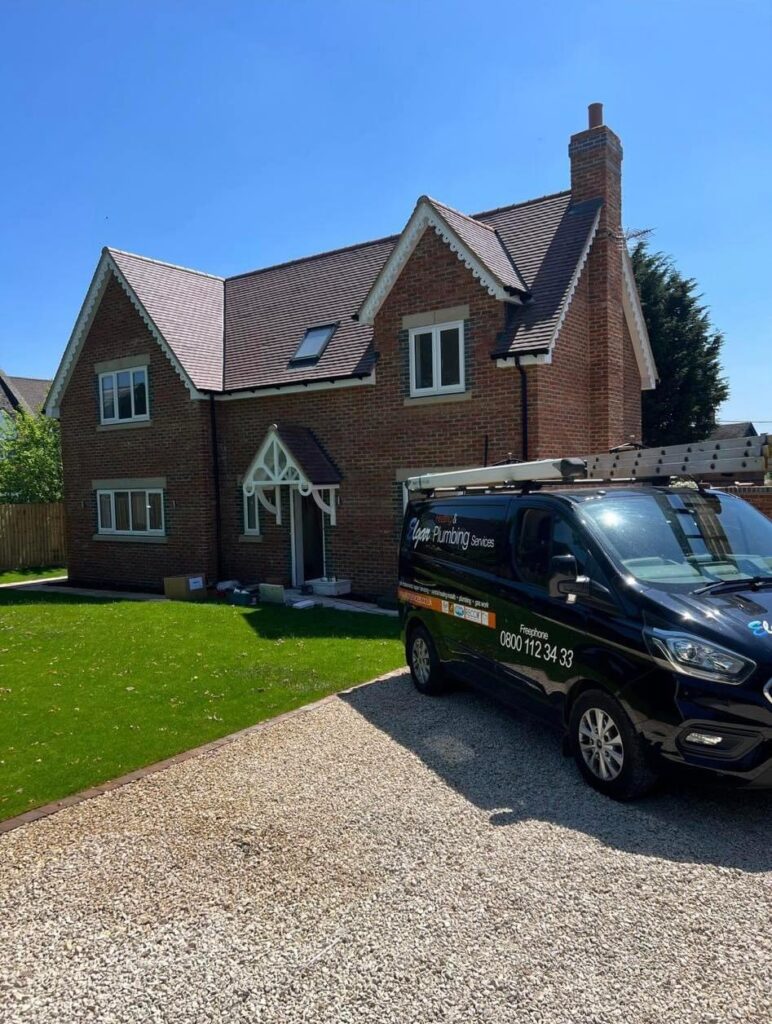 Elgar Heating and Plumbing Van outside customers property.